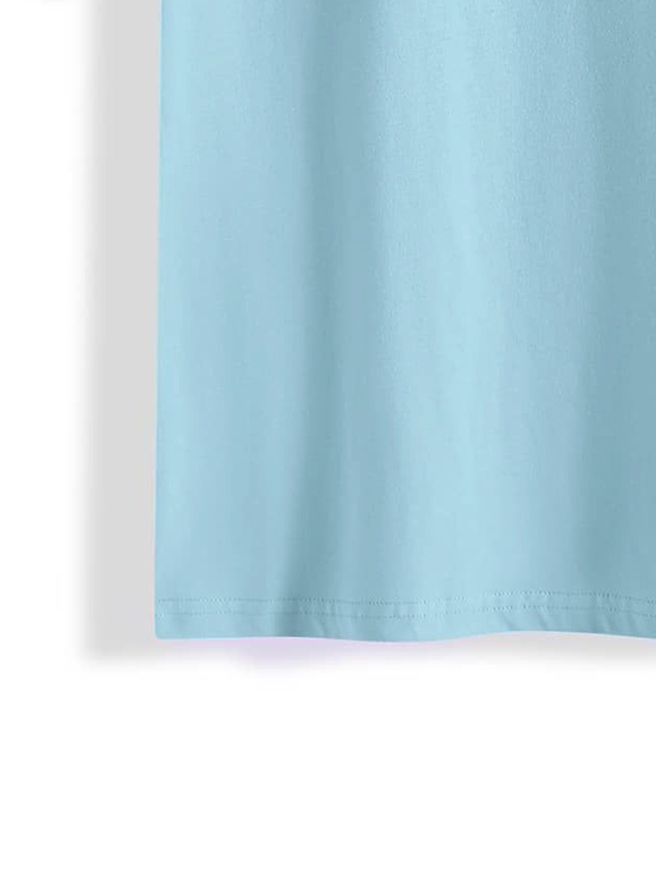 Close-up of blue T-shirt hem detail