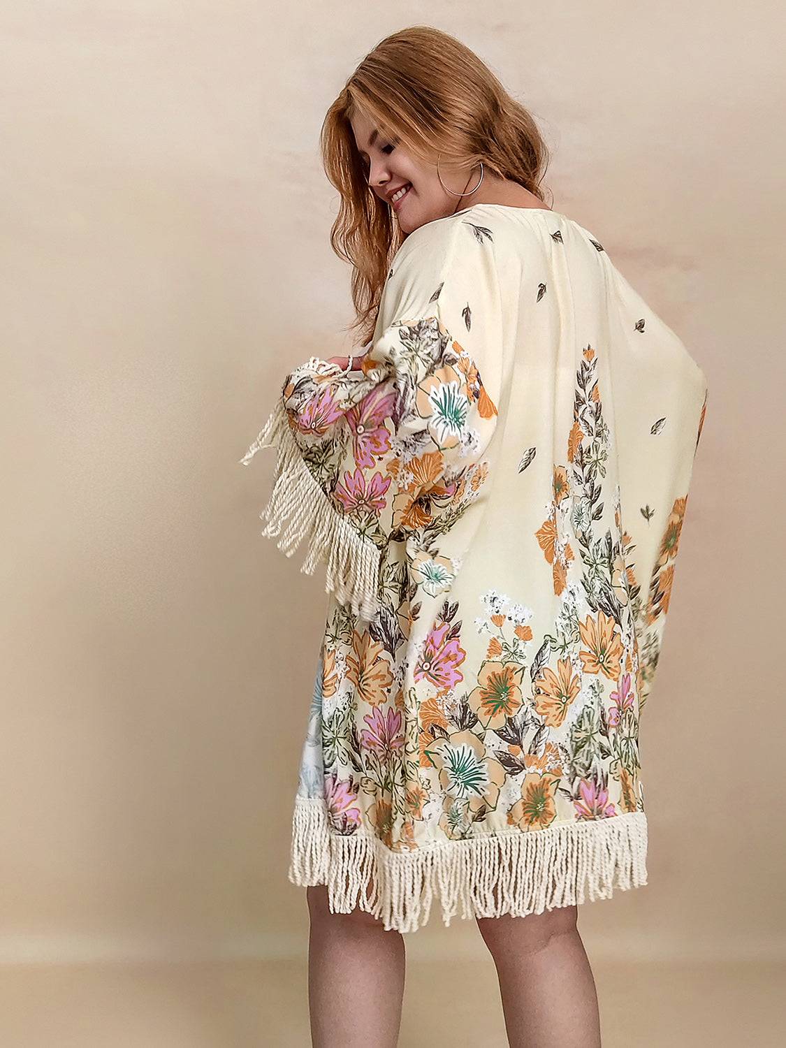 Back view of floral fringe open front cardigan