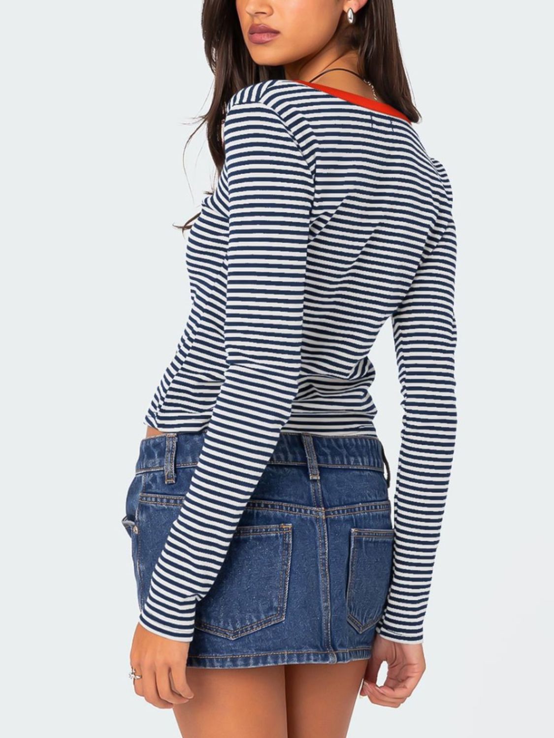 Back view of navy and white striped T-shirt with red trim
