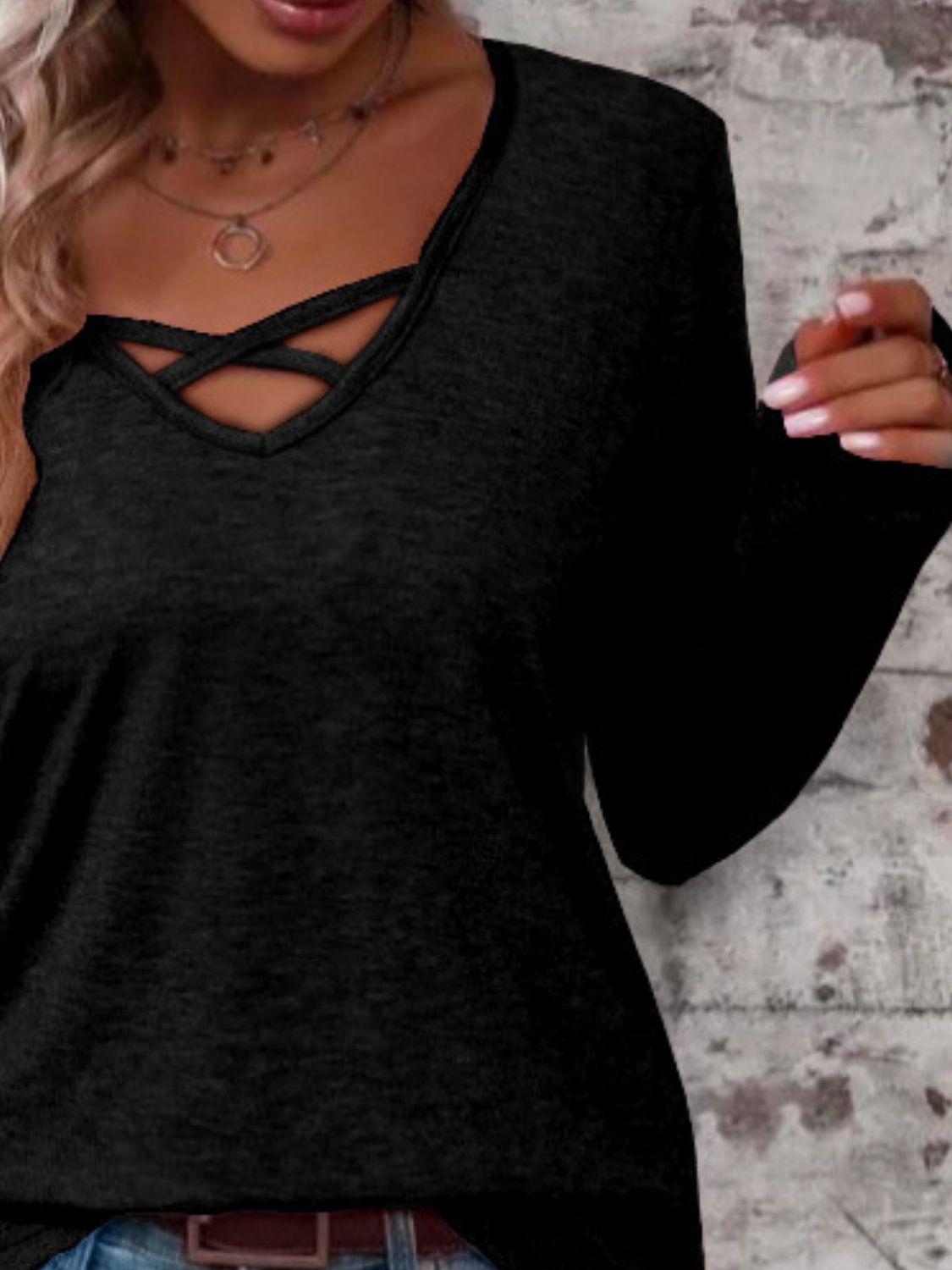 Black crisscross V-neck long sleeve T-shirt, close-up front view