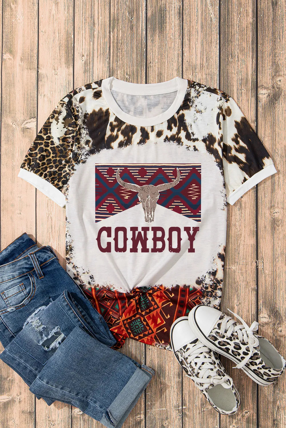 Cowboy graphic T-shirt styled with jeans and sneakers