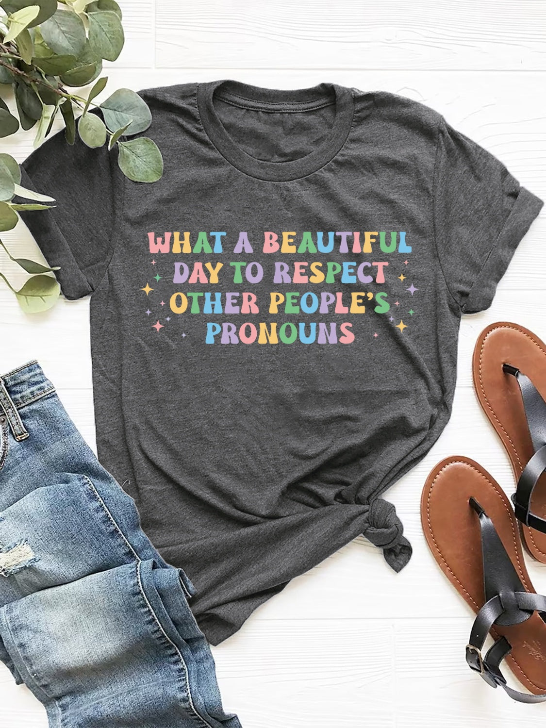 Gray T-shirt with colorful pronoun respect message