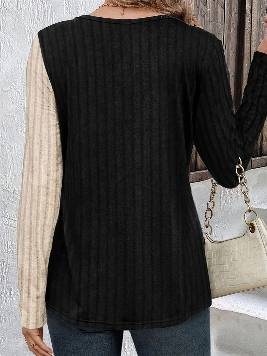 Back view of contrast round neck T-shirt with long sleeves.