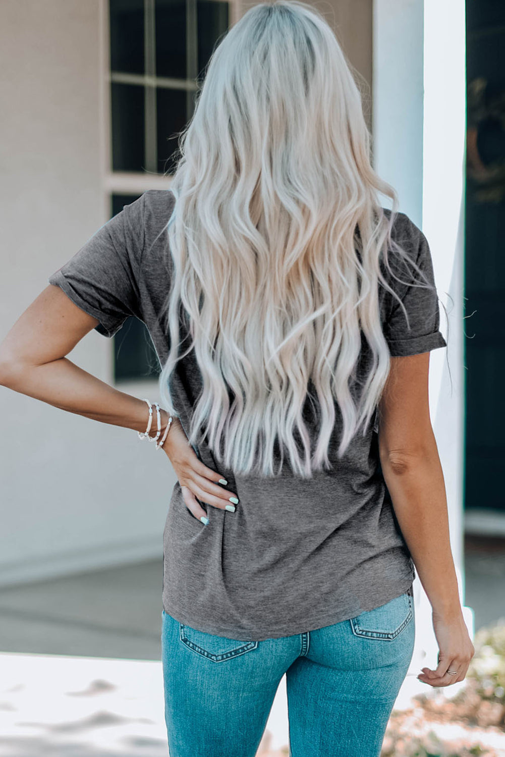 Dark gray T-shirt with bow graphics, back view