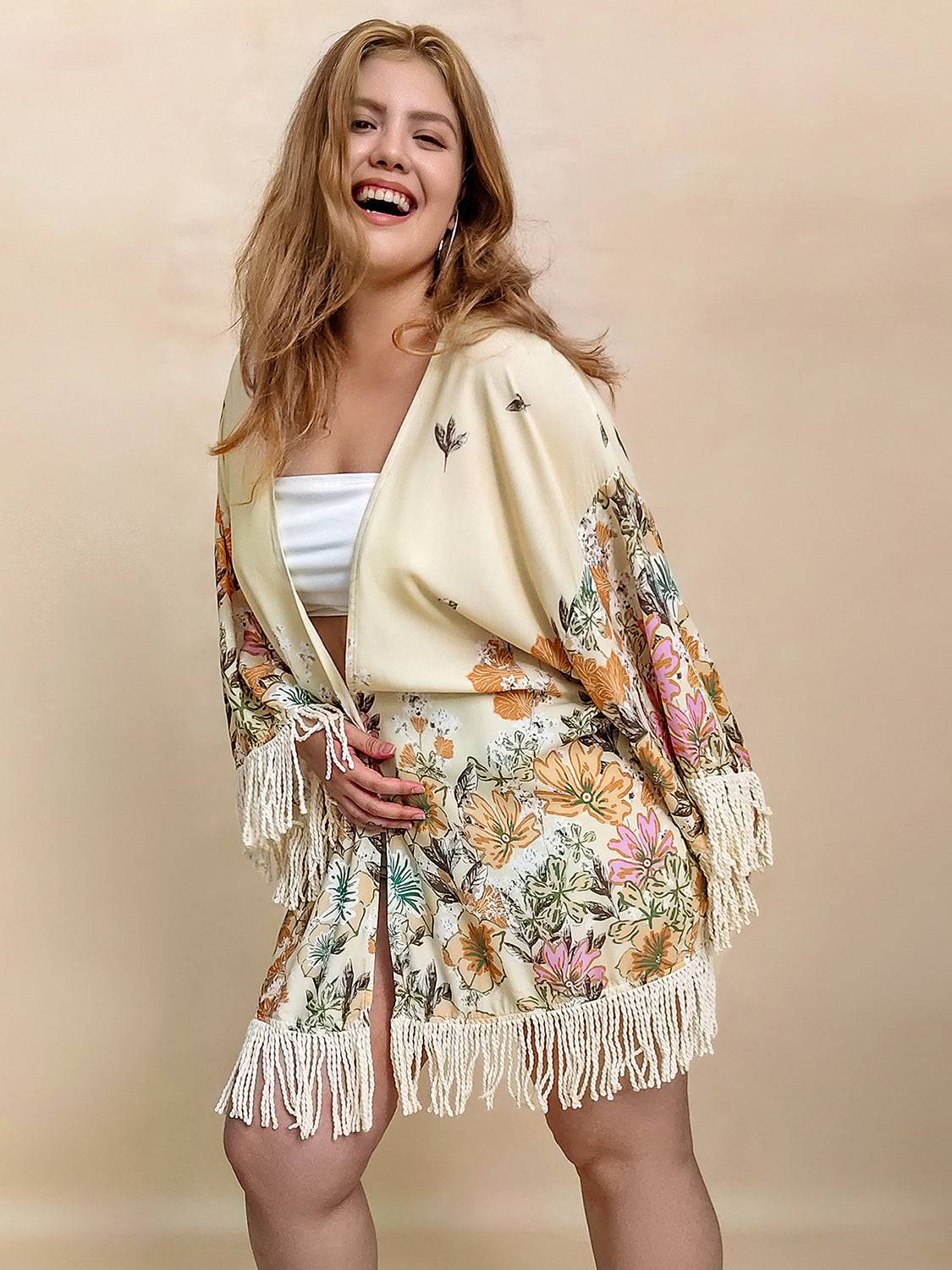 Model wearing floral fringe cardigan, front view
