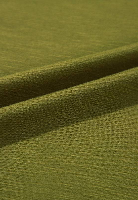 Fabric texture of green faux two piece top