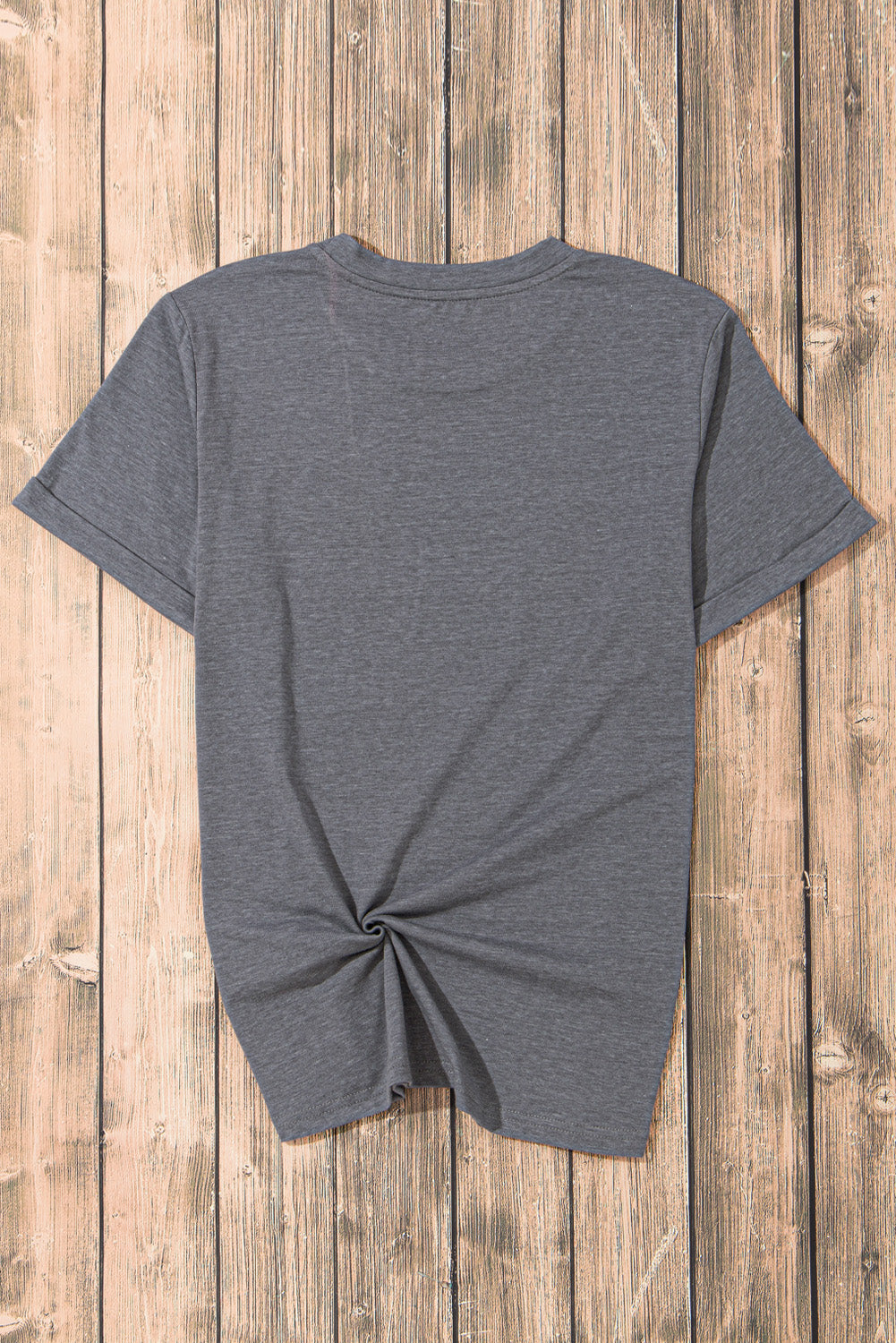 Back of gray USA round neck t-shirt on wooden background