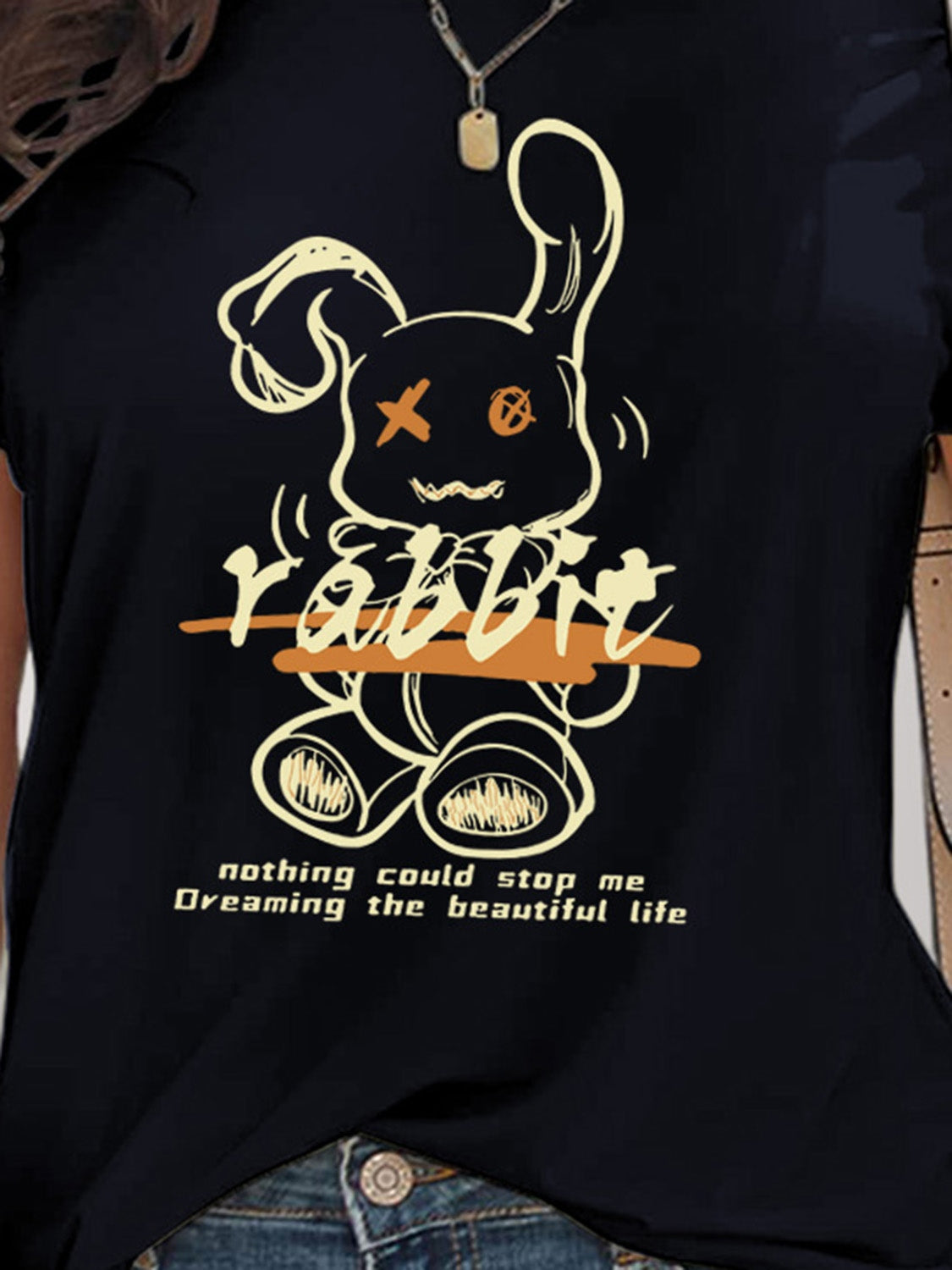 Close-up of black rabbit graphic on t-shirt