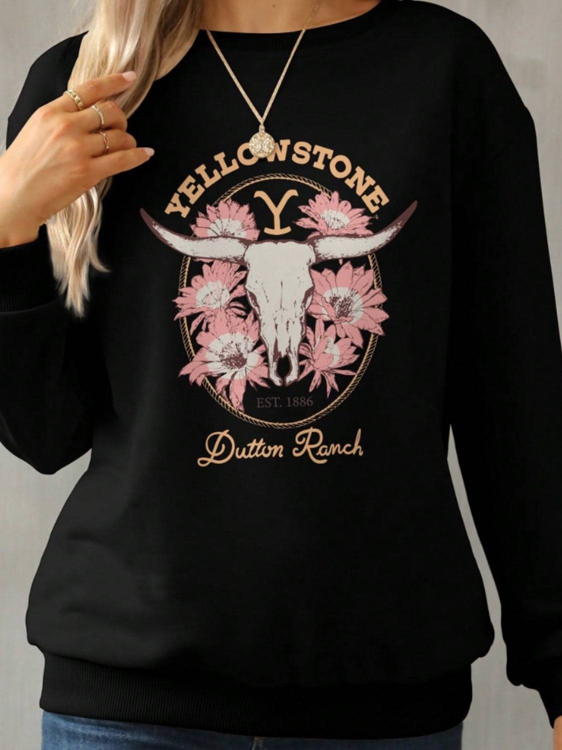 Close-up of Yellowstone Dutton Ranch graphic on sweatshirt