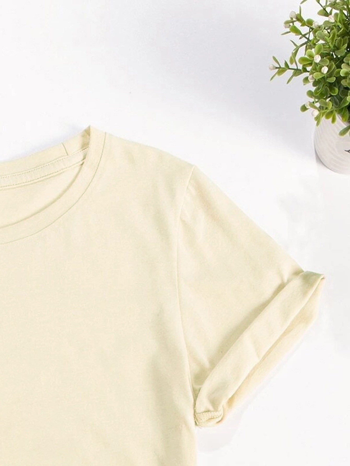 Close-up of light yellow t-shirt sleeve detail