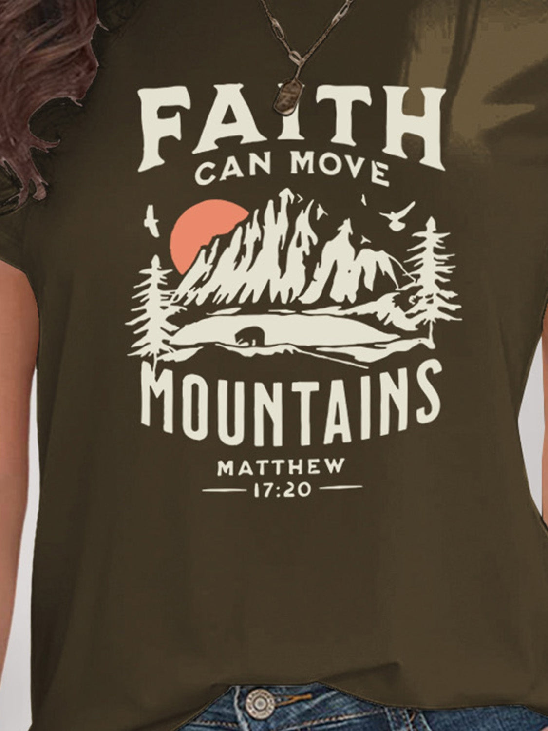 Close-up of olive t-shirt mountain graphic