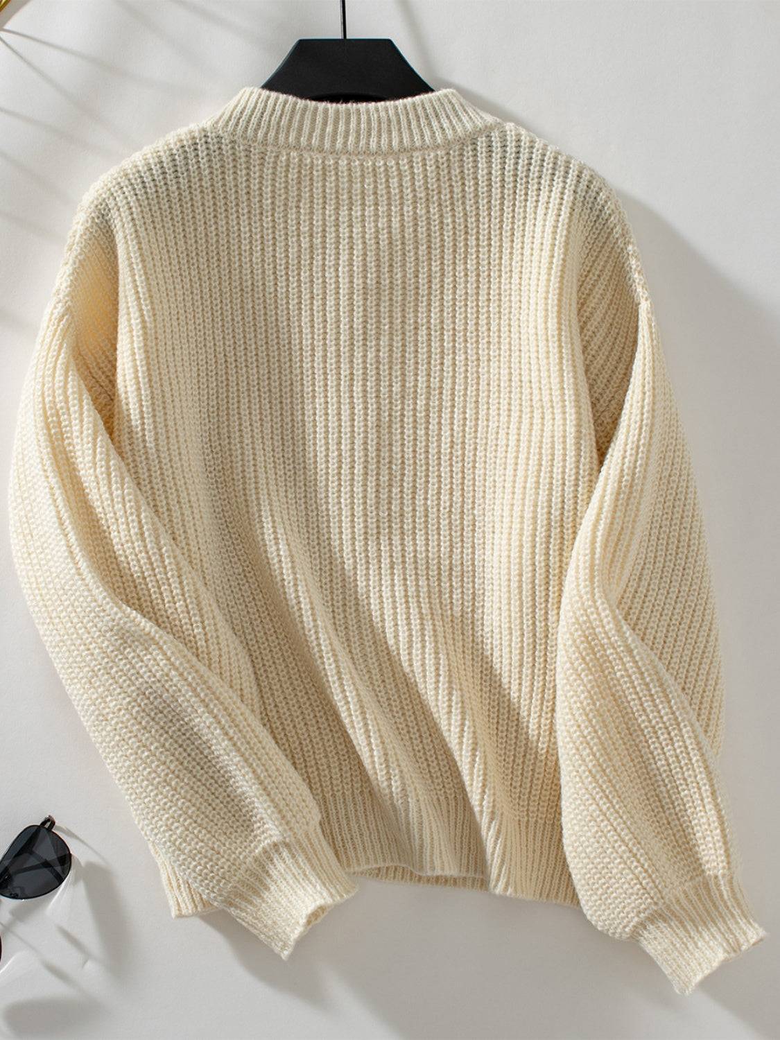 Back view of cream button down long sleeve cardigan