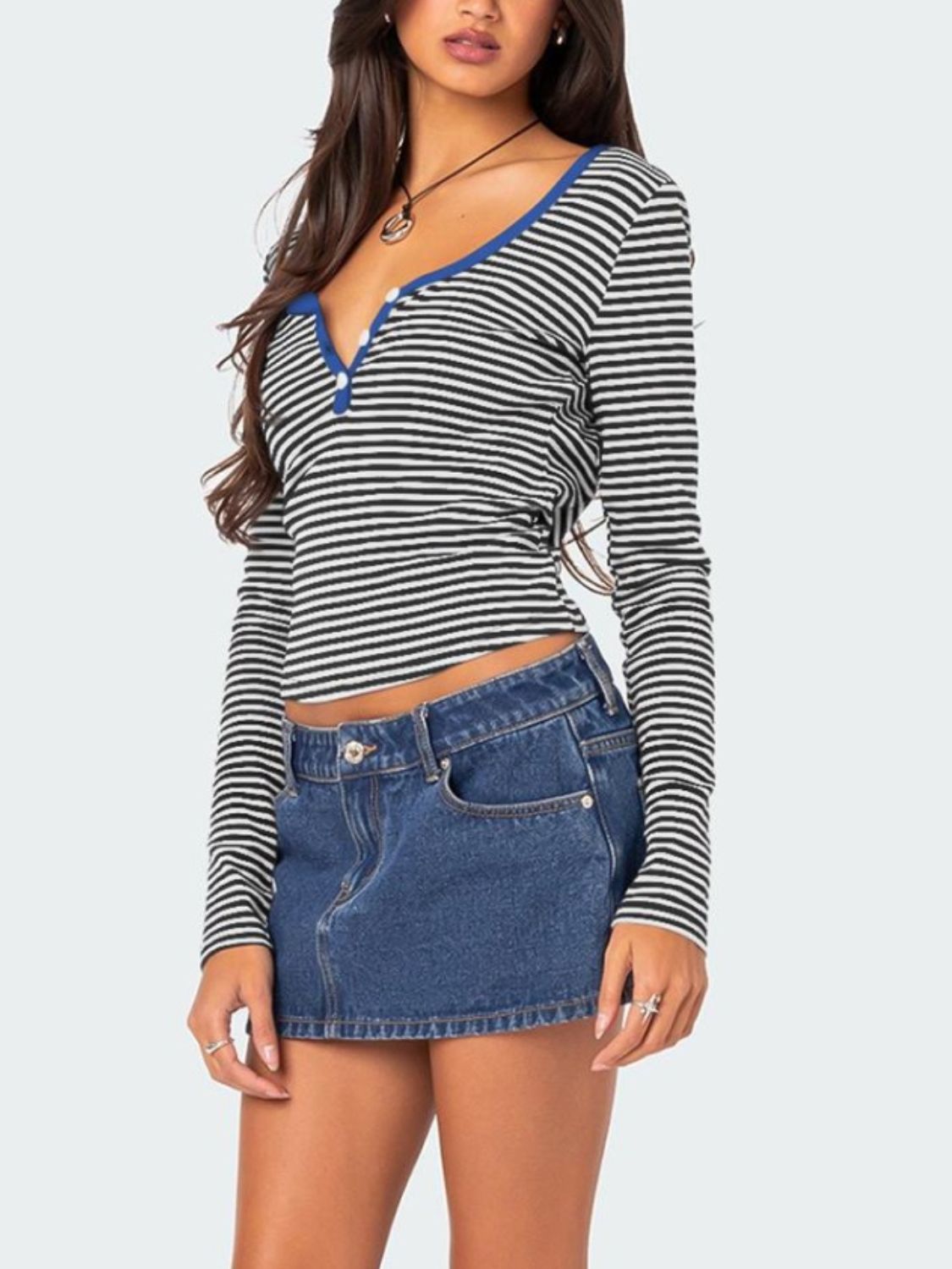 Black and white striped T-shirt paired with denim skirt