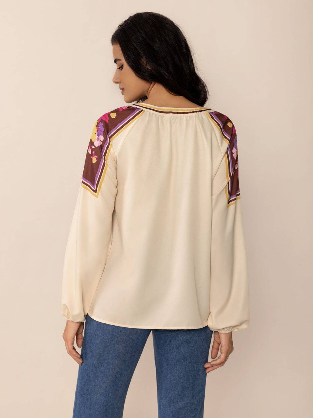 Back view of printed notched long sleeve blouse