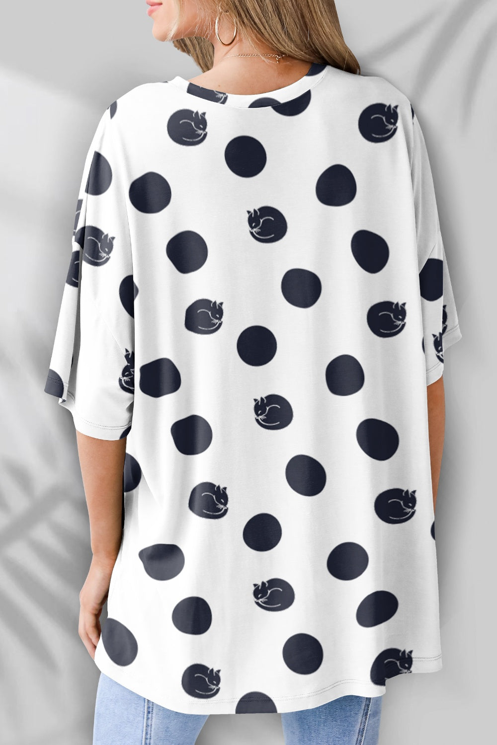Back view of polka dot t-shirt with cat design