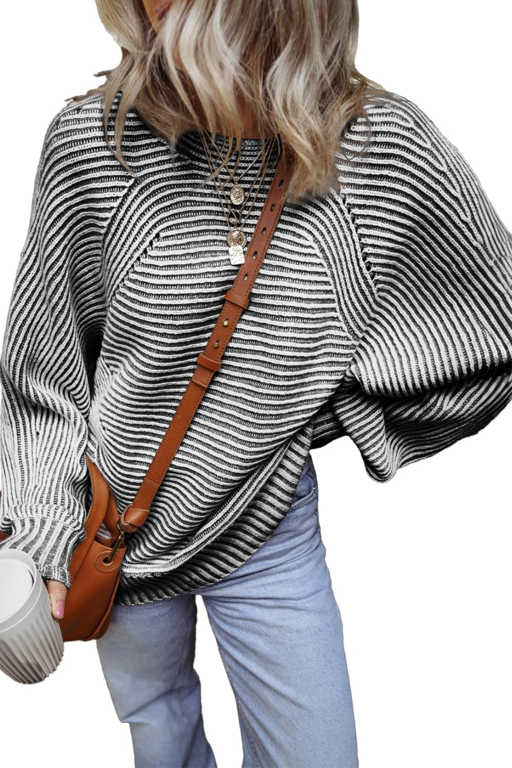 Black and white textured striped top with brown bag
