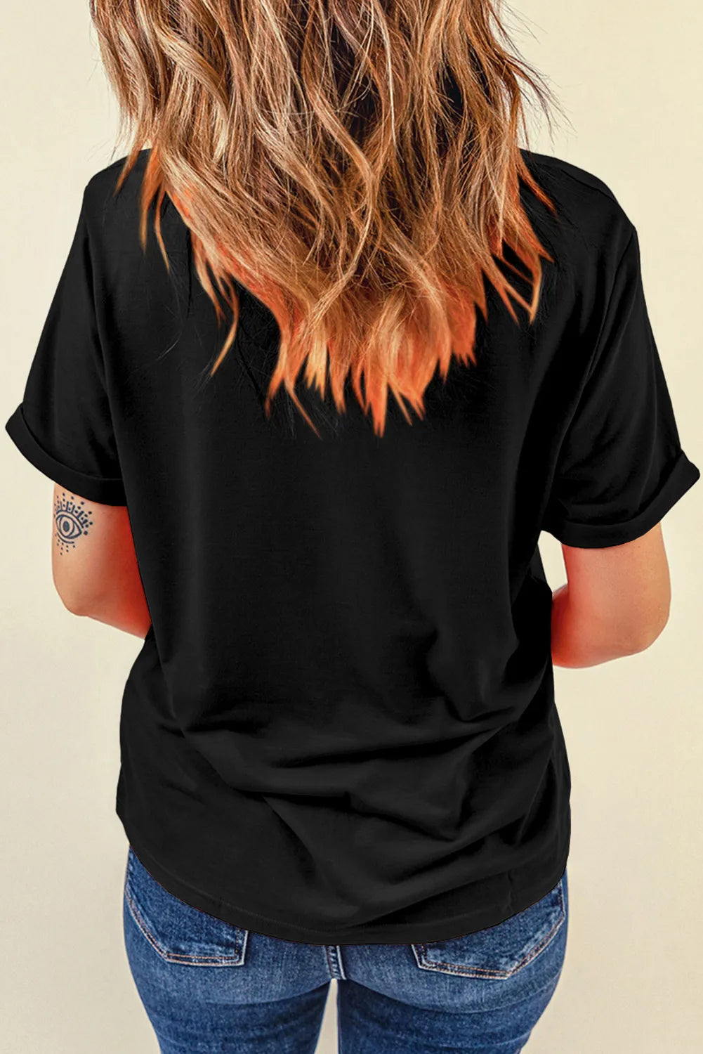 Back view of black graphic T-shirt