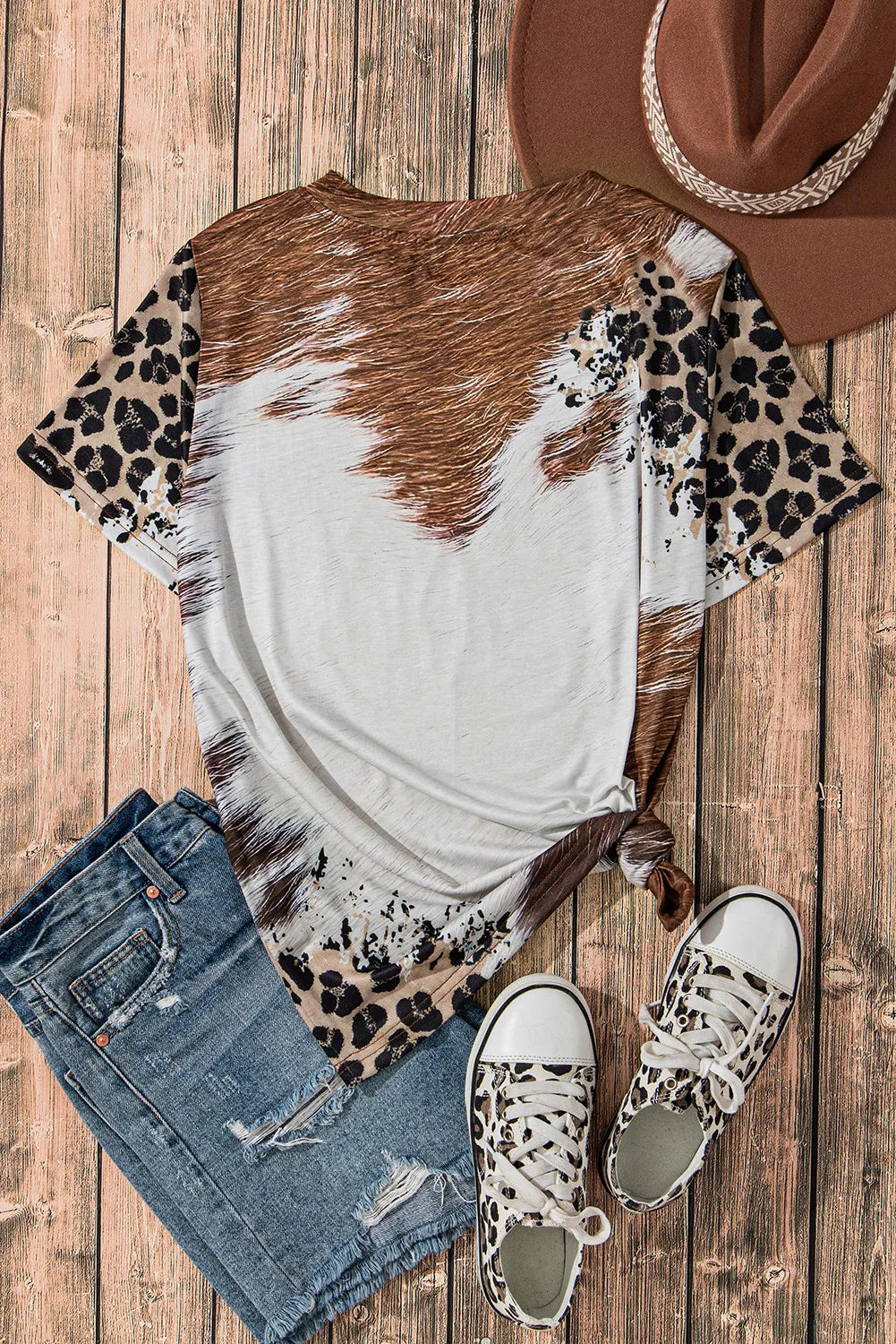 Back view of sunflower graphic t-shirt with denim shorts