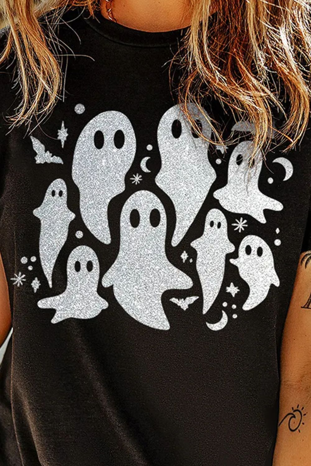 Close-up of ghost design on black round neck T-Shirt