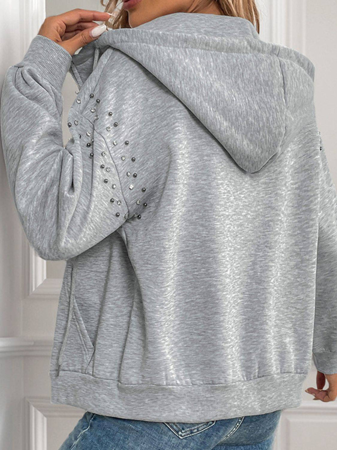 Back view of gray rhinestone hoodie with hood