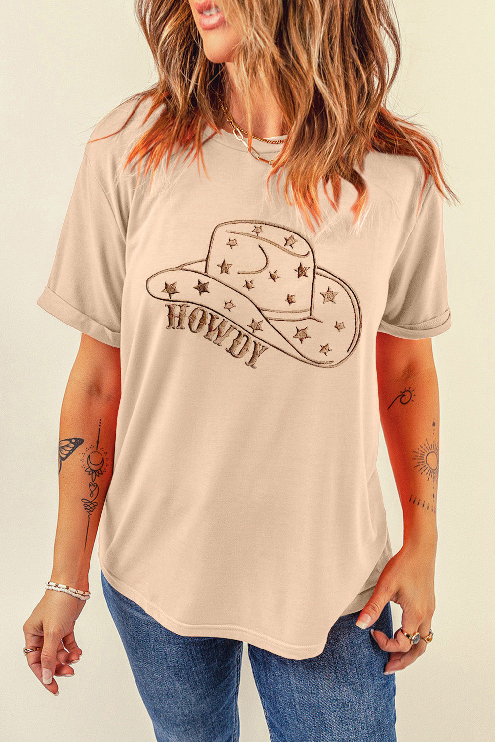 Casual beige t-shirt featuring hat graphic and &