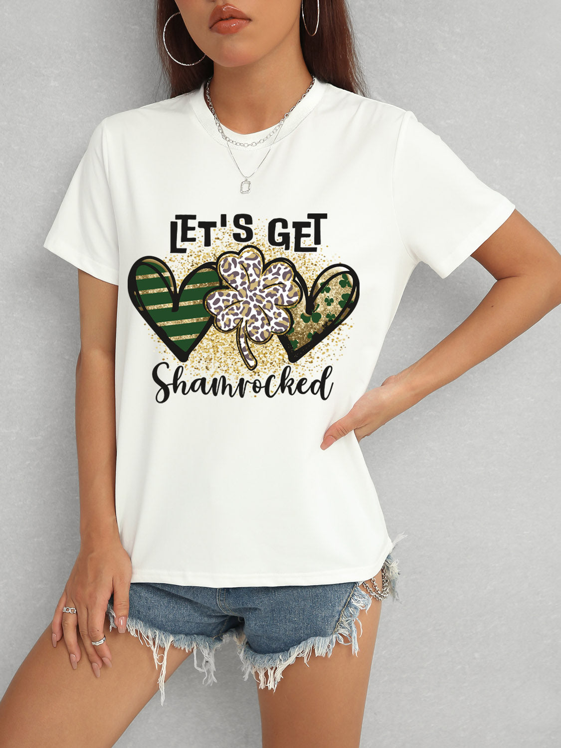 White T-Shirt with Shamrock Design and Denim Shorts
