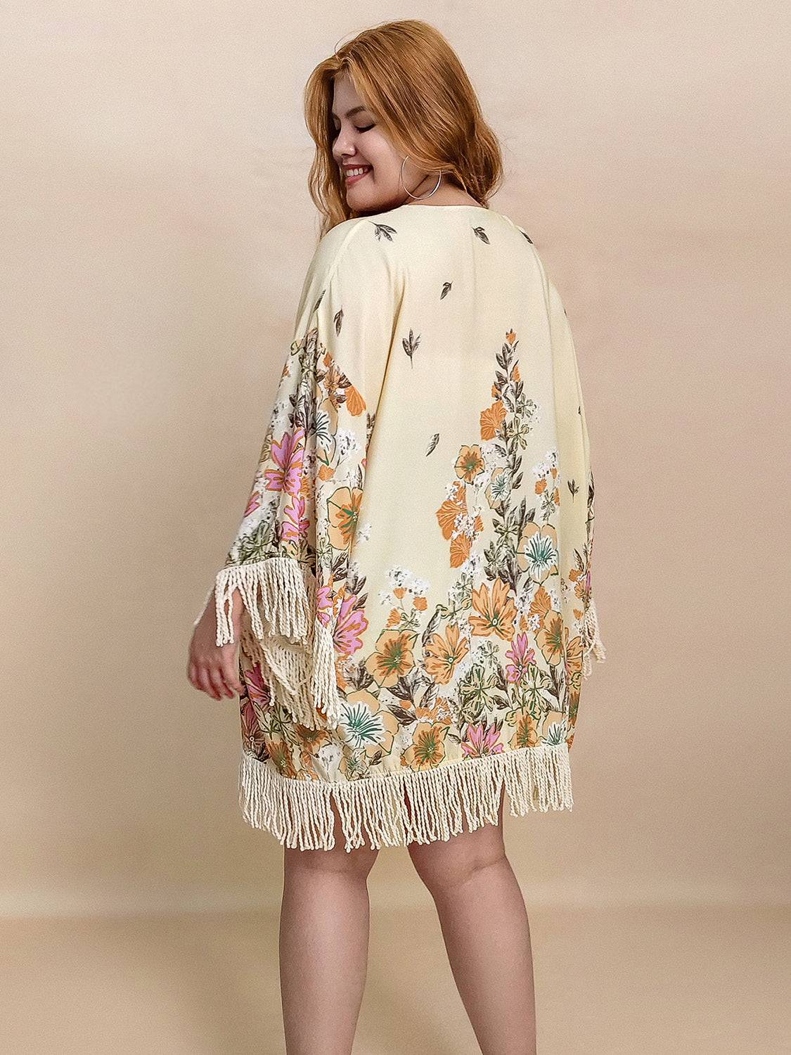 Back view of floral printed fringe cardigan
