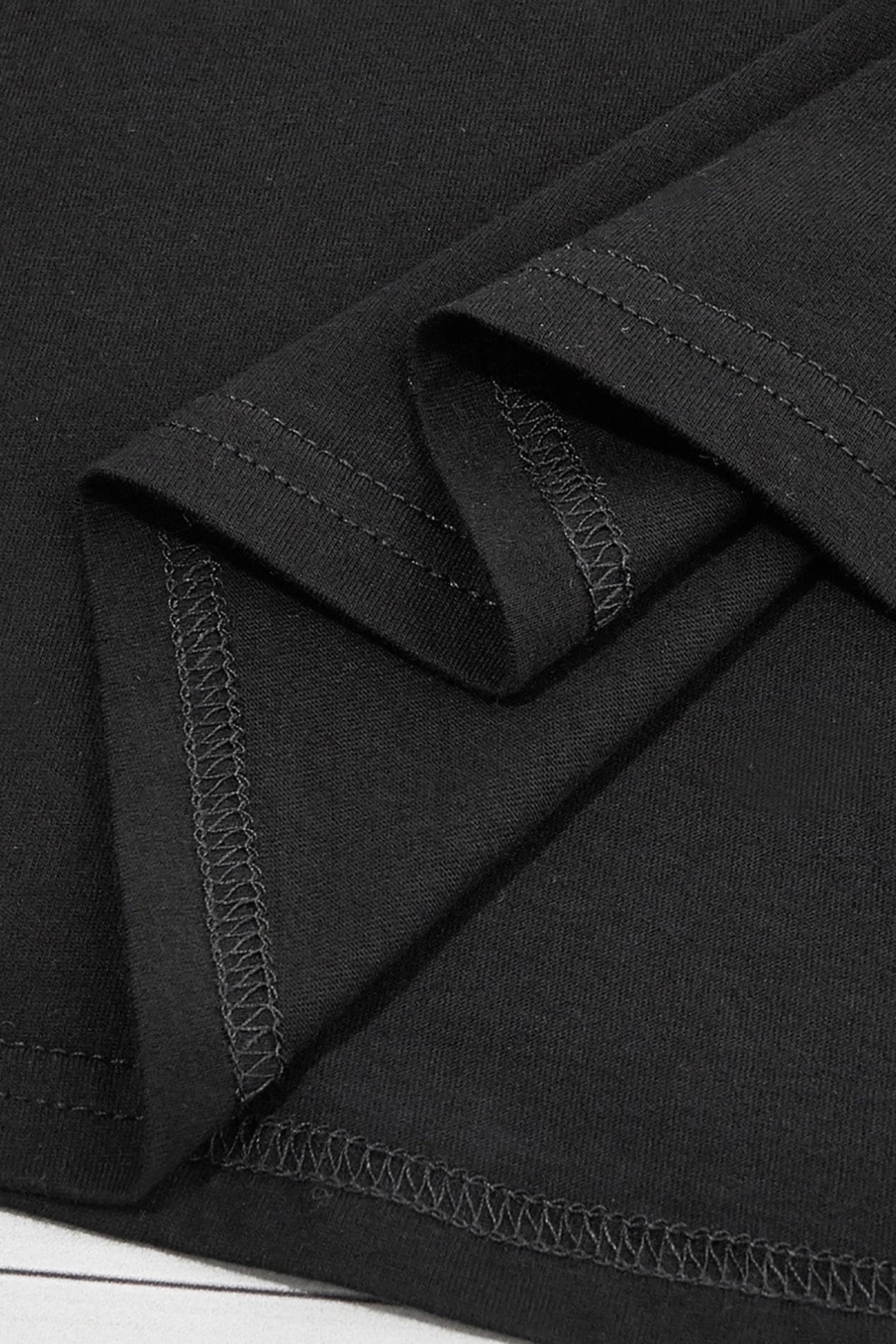 Close-up of black T-shirt stitching detail