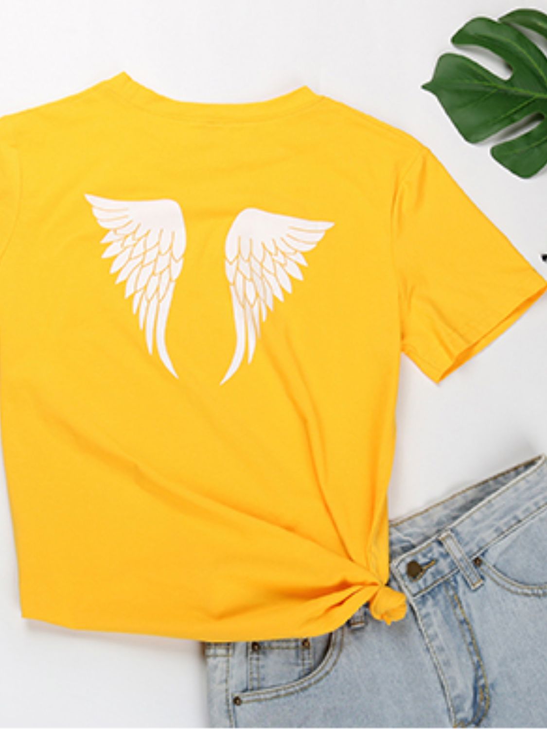 Back view of yellow Angel T-shirt with wing design