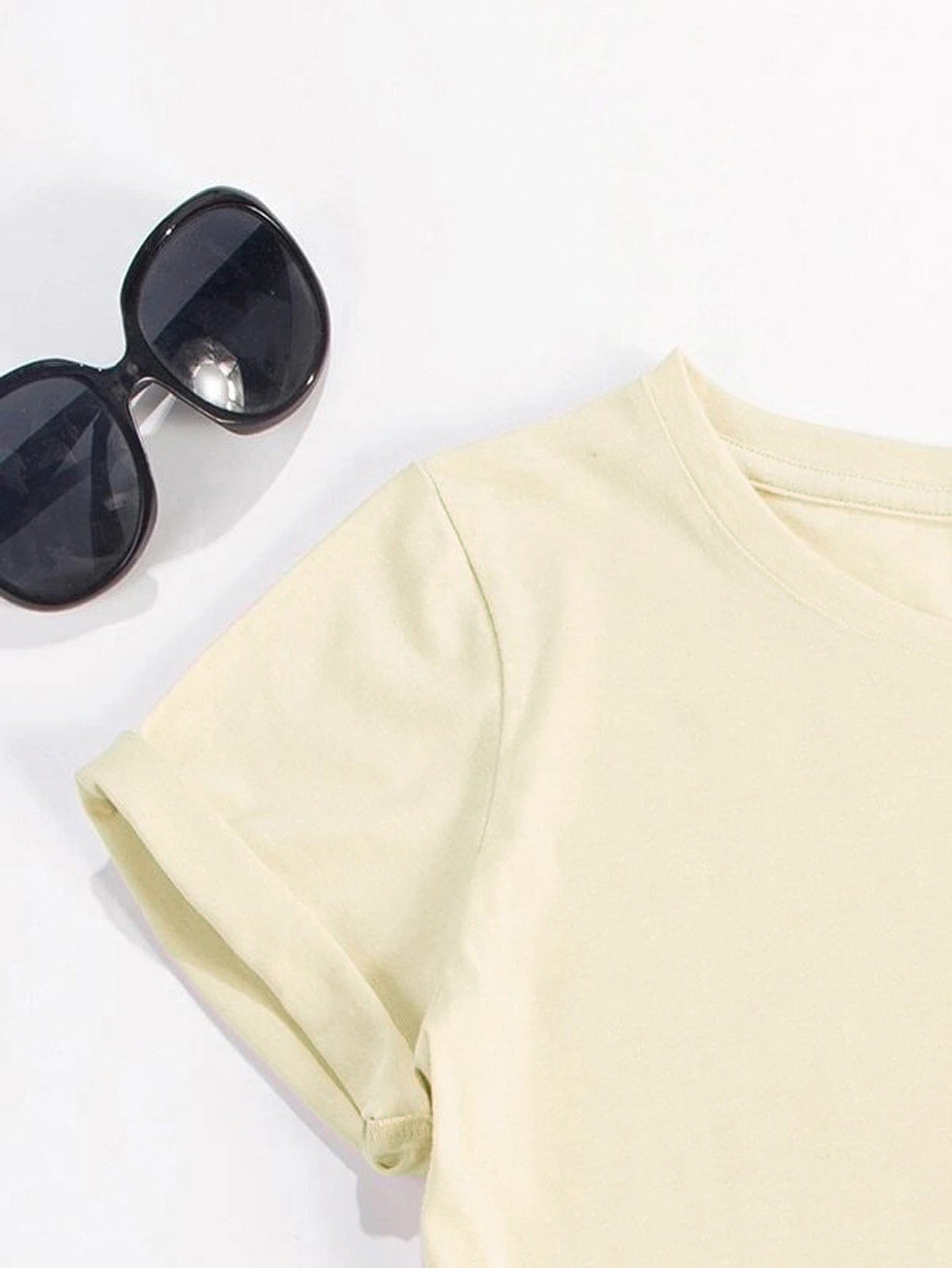 Close-up of yellow short sleeve t-shirt fabric