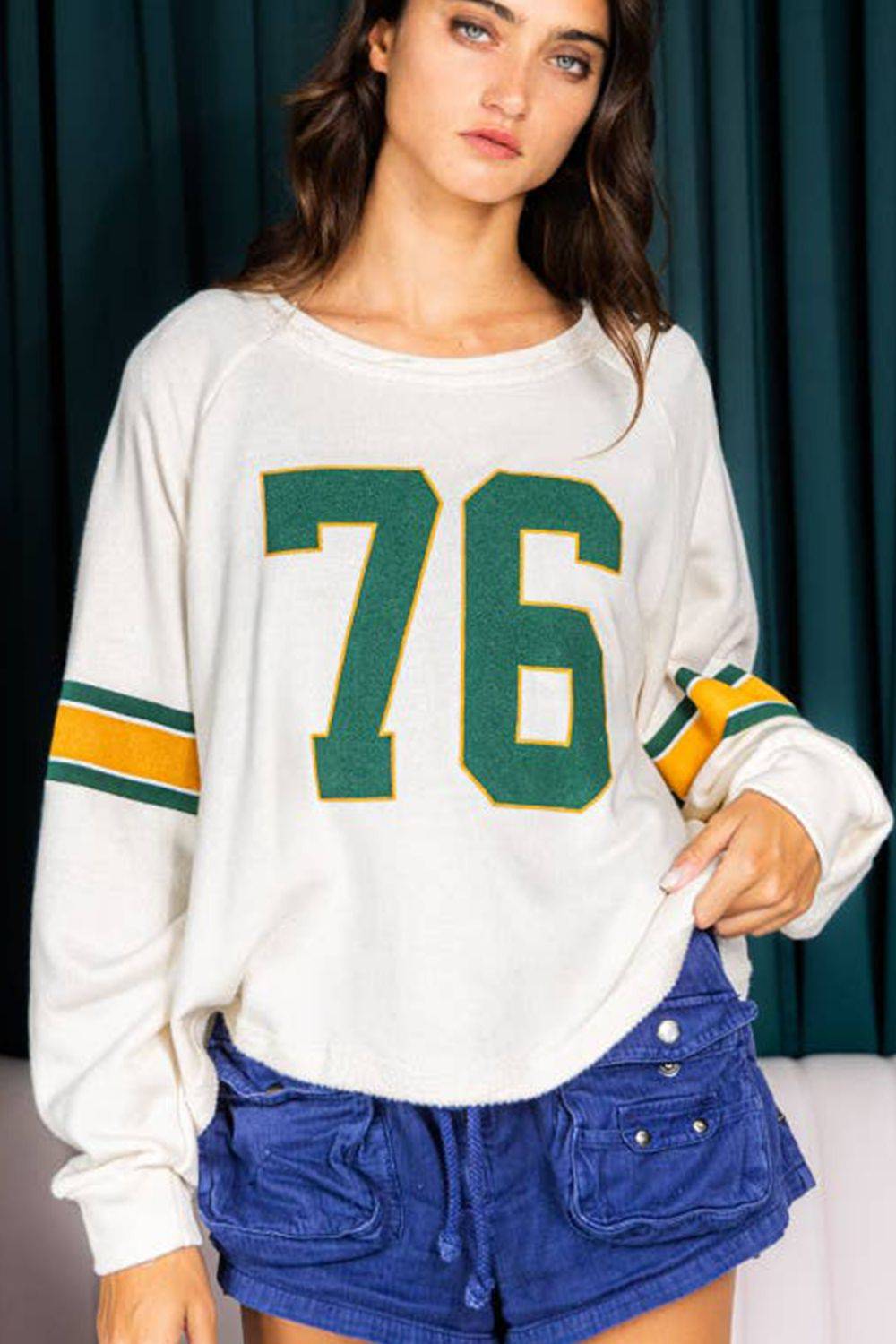 White long sleeve top featuring number 76