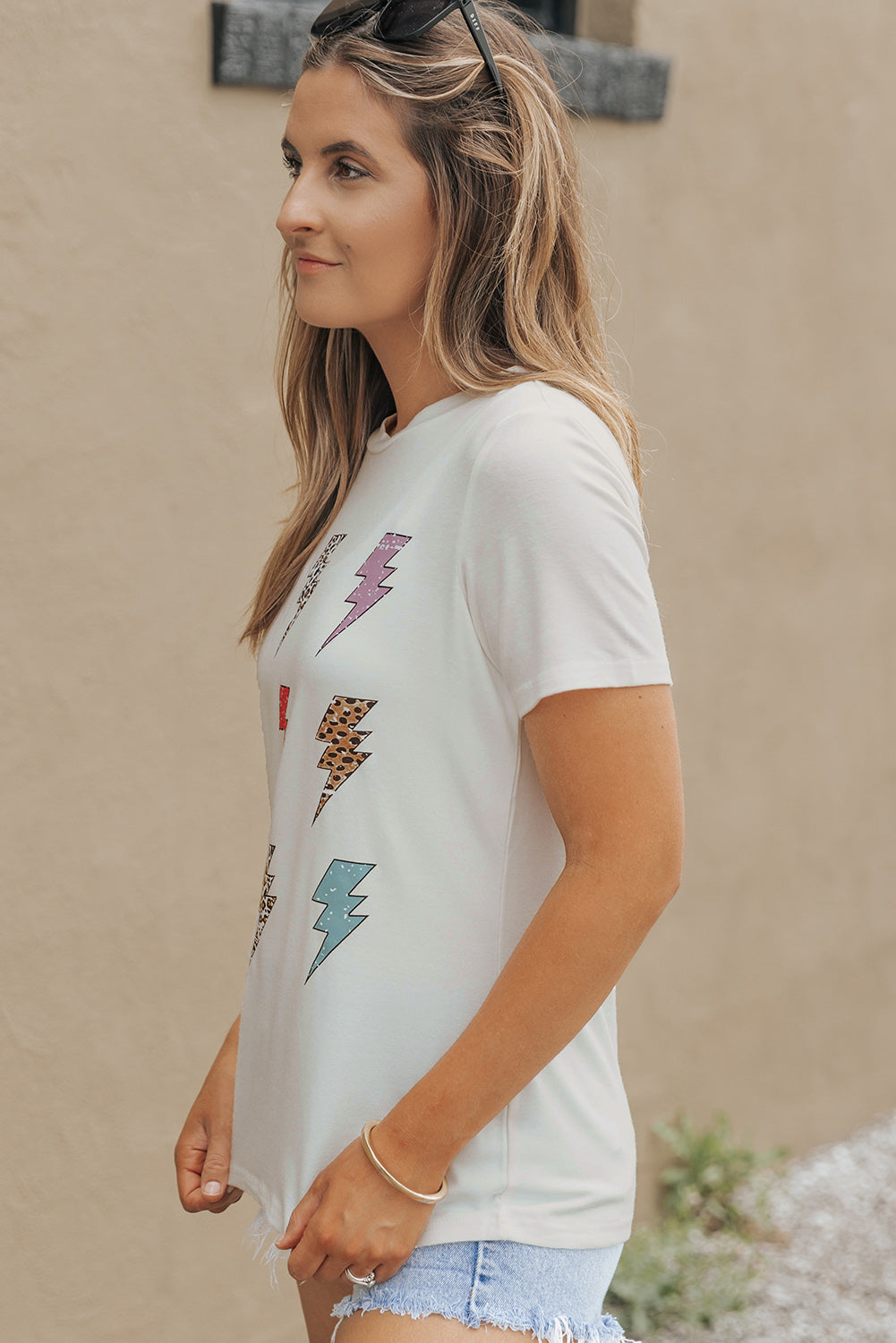 Side view of lightning graphic T-shirt on model