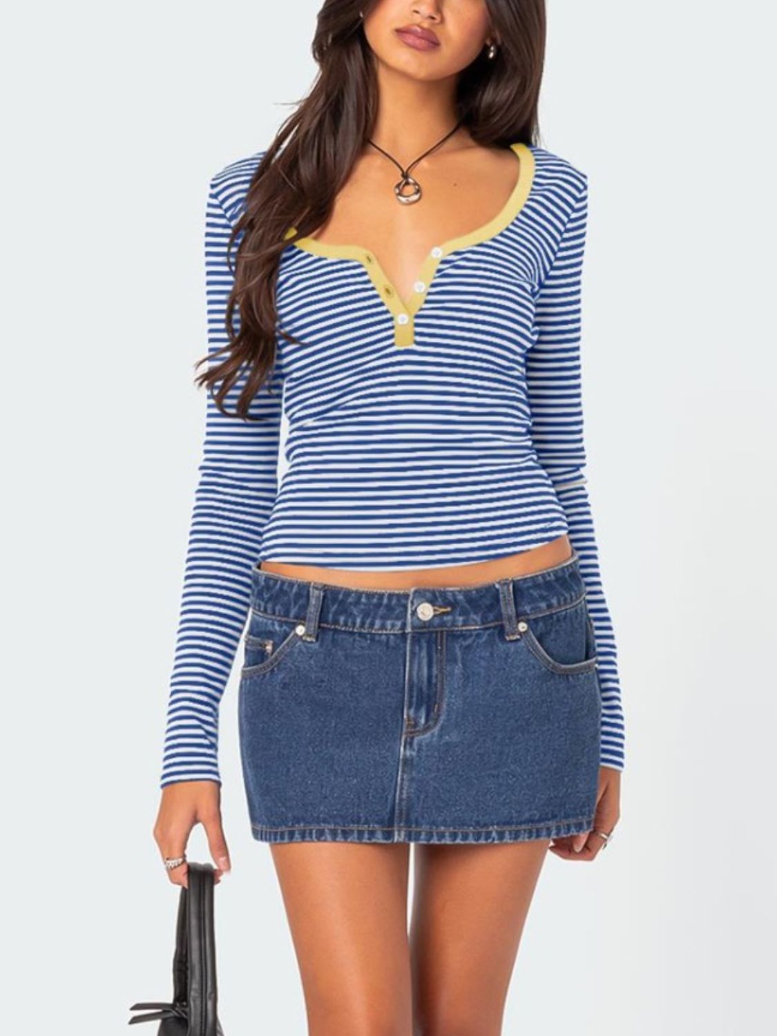 Front view of blue striped T-shirt with yellow trim and denim skirt