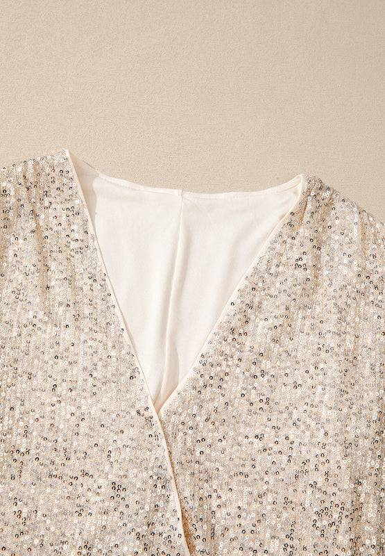 Close-up of sequin detail on bodysuit neckline