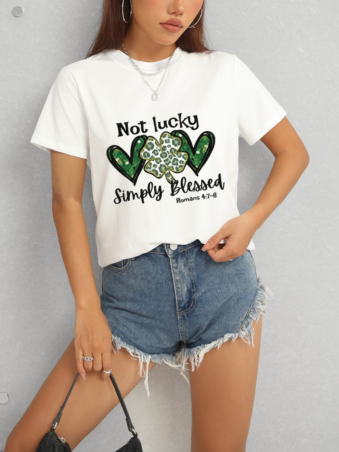 White T-shirt with green heart clover design
