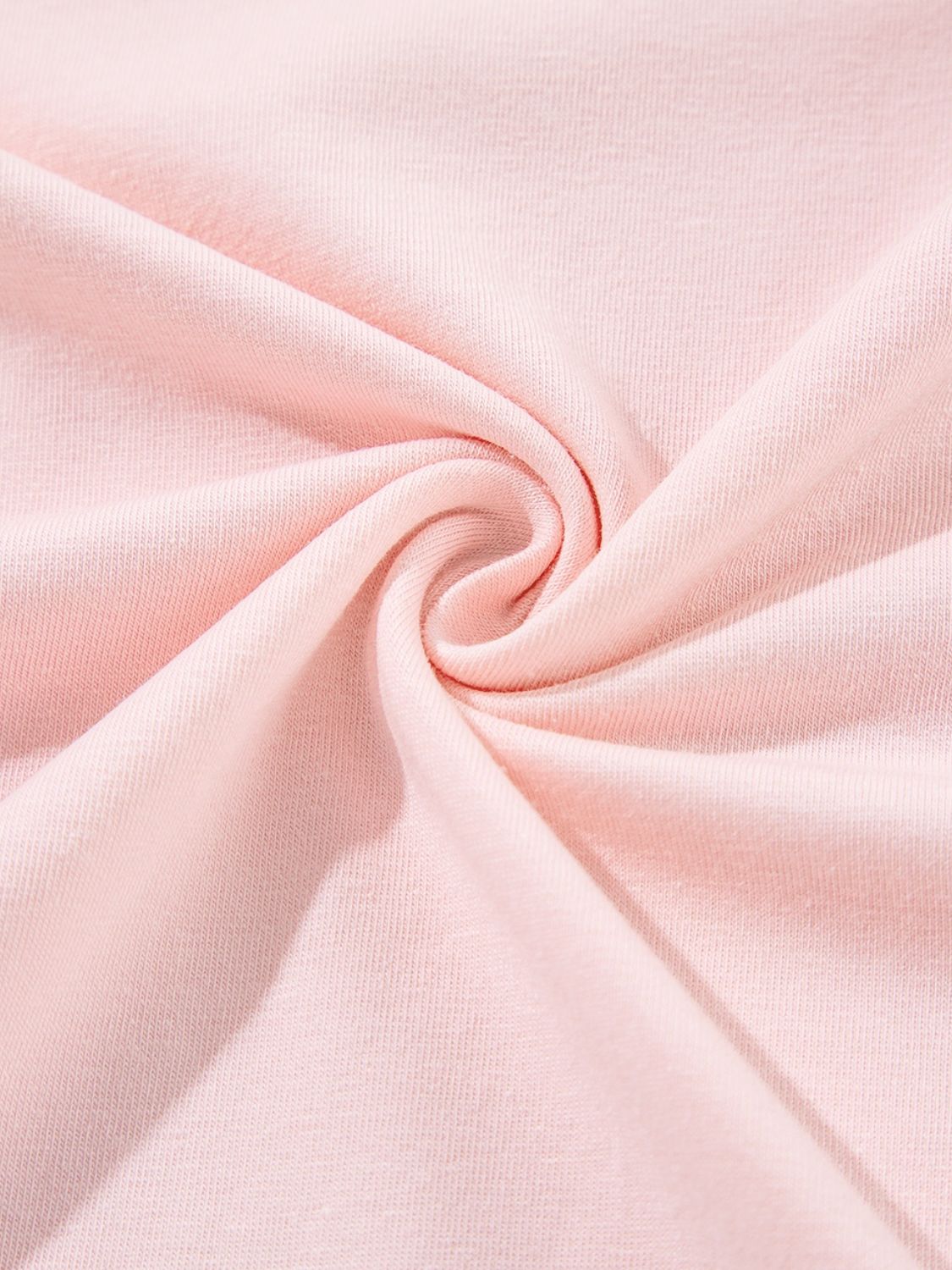 Detail of fabric texture on pink T-shirt