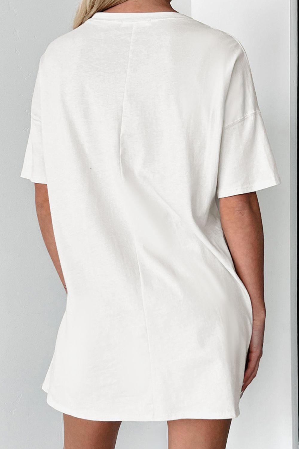 Back view of plain white round neck half sleeve T-shirt