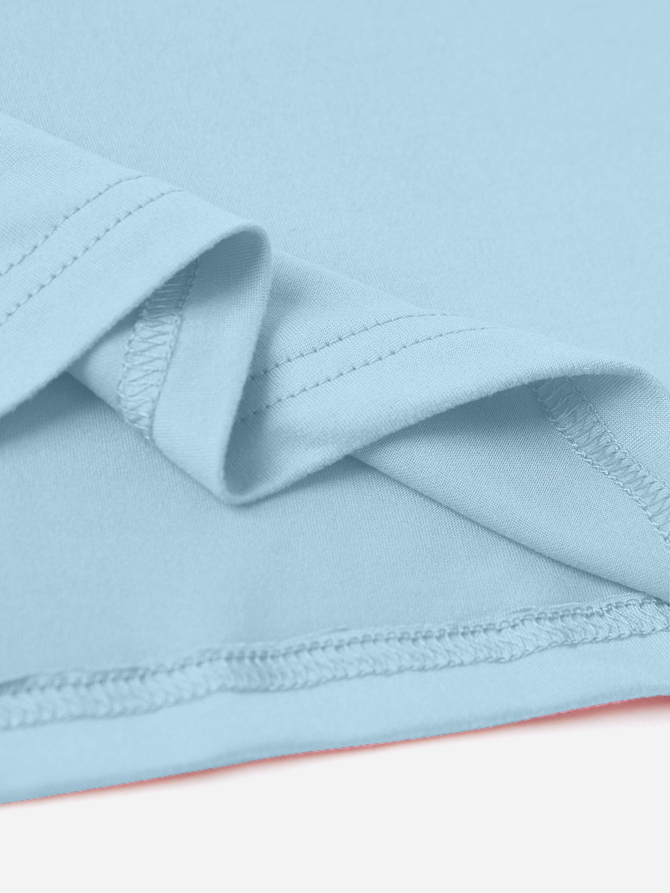 Close-up of blue T-shirt fabric and stitching