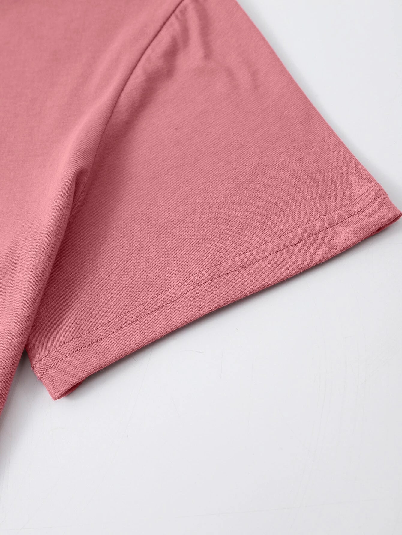 Close-up of pink T-shirt sleeve detail