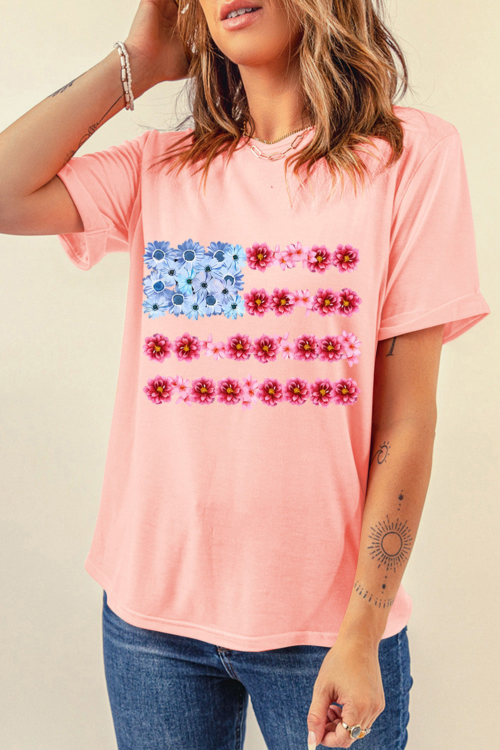 Round neck pink T-shirt with floral graphic design
