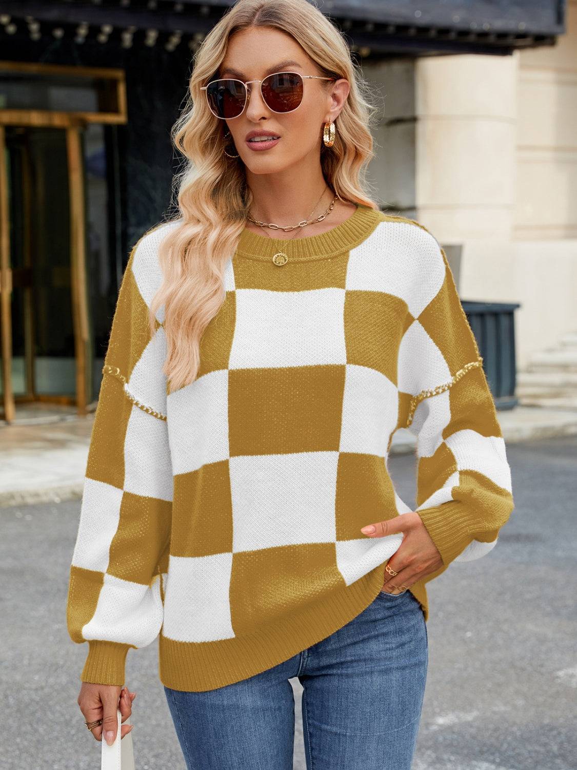 Front view of yellow and white checkered sweater