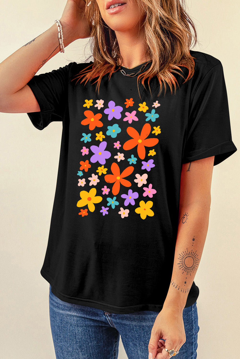 Round neck black T-shirt featuring vibrant flower design