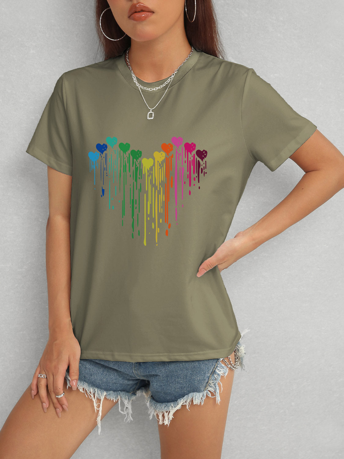 Olive short sleeve t-shirt featuring colorful heart pattern