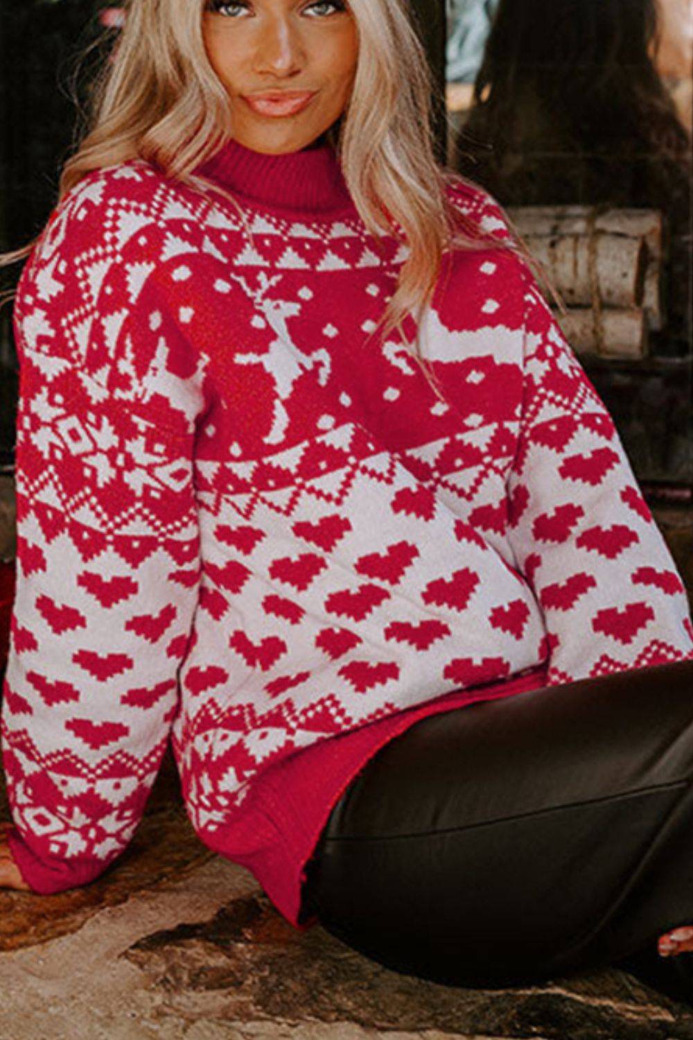 Model wearing Christmas turtleneck sweater with reindeer