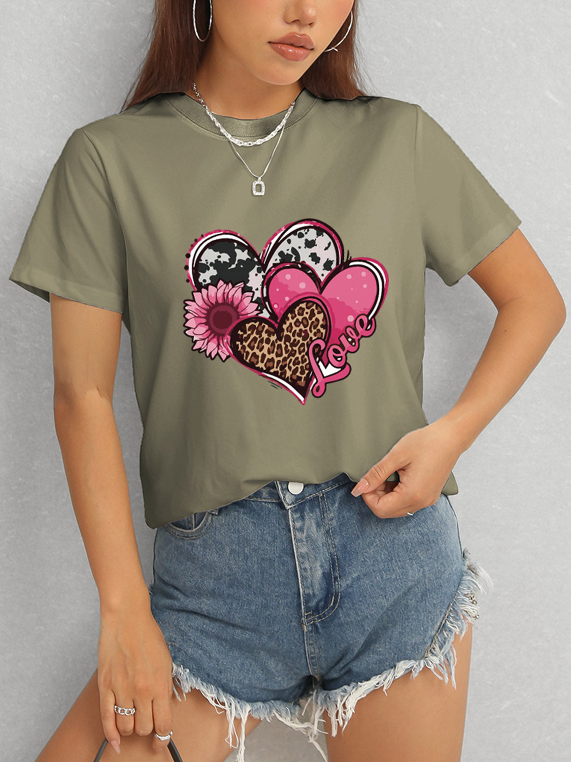 Olive short sleeve t-shirt featuring heart and love graphic