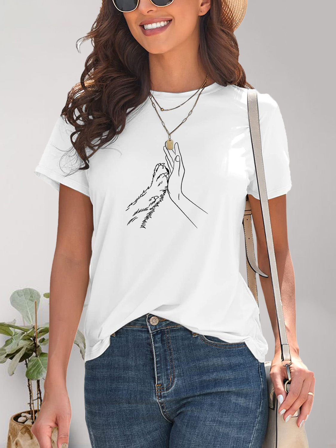 White T-shirt with hand and paw graphic