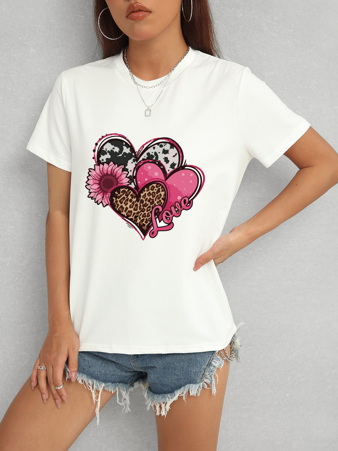 White short sleeve t-shirt featuring heart and love graphic