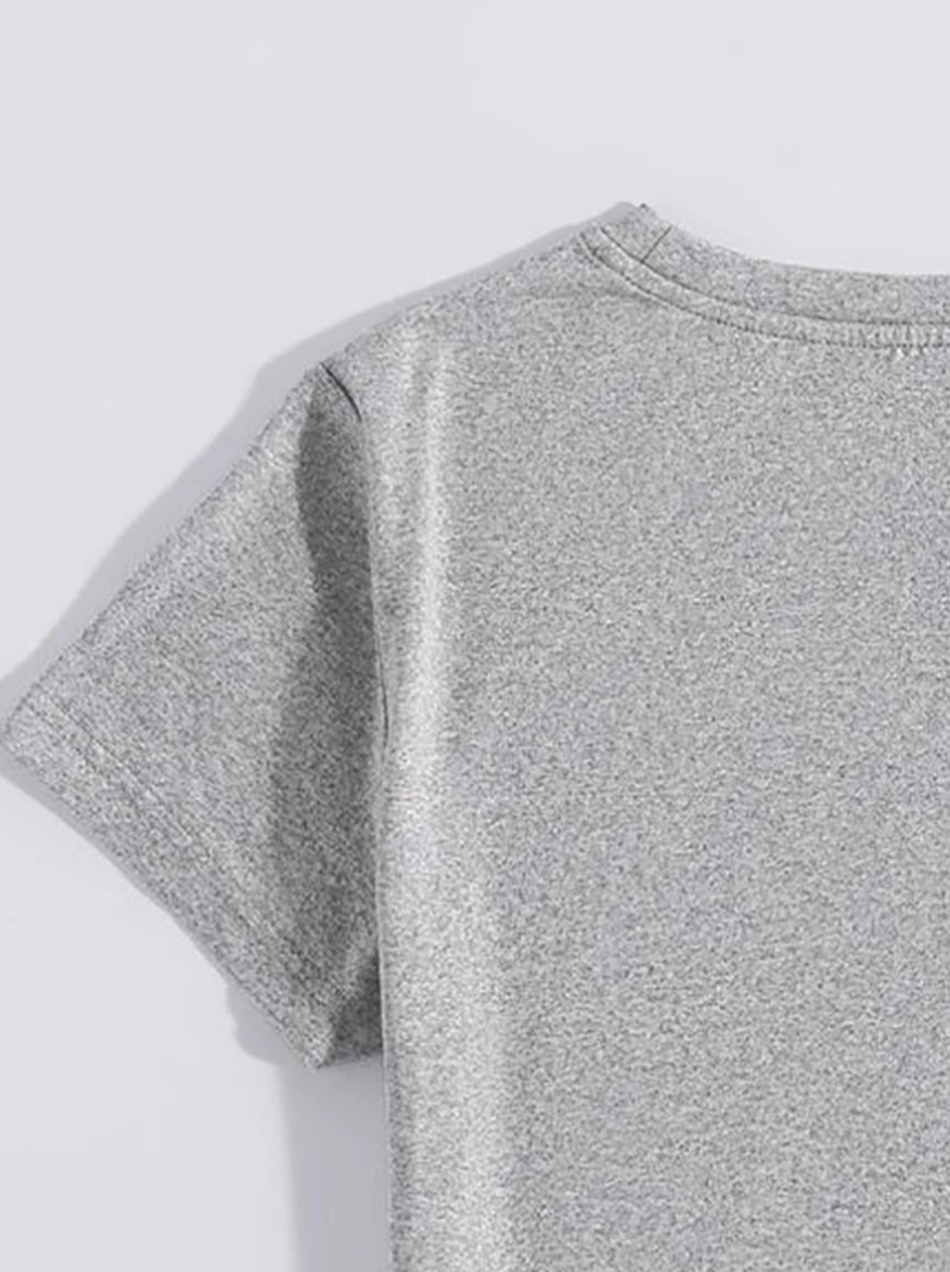 Close-up of light gray t-shirt sleeve detail