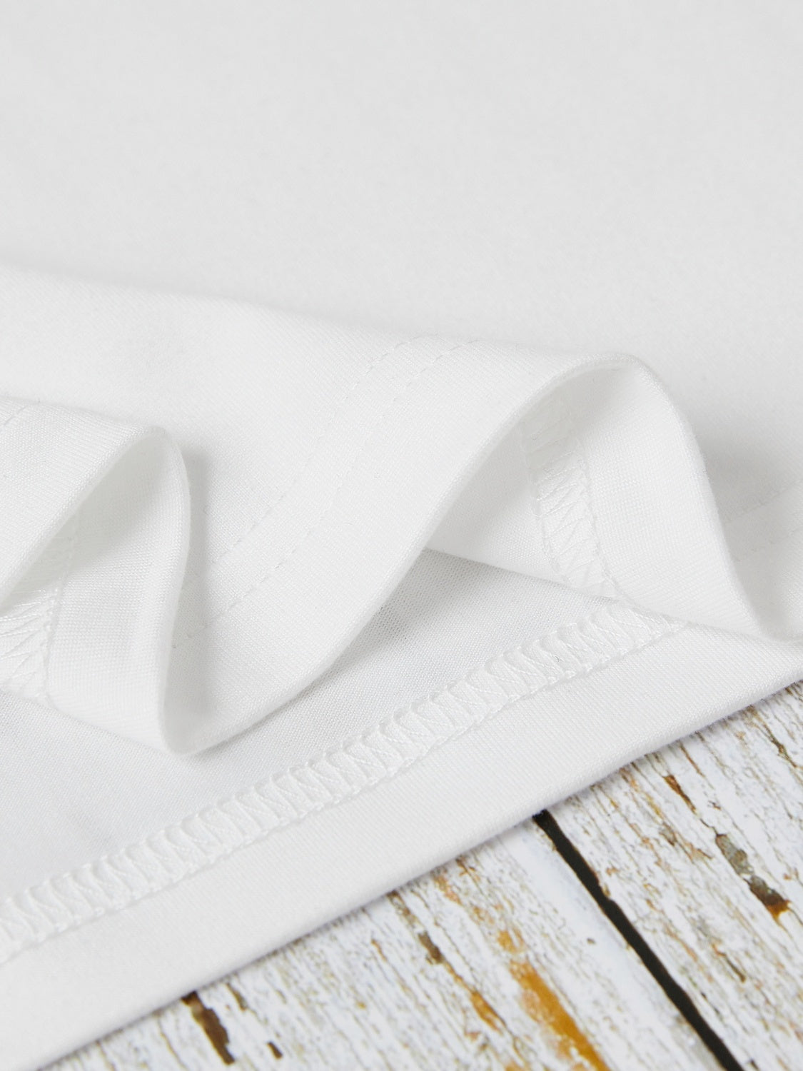 Close-up of white short sleeve T-shirt fabric