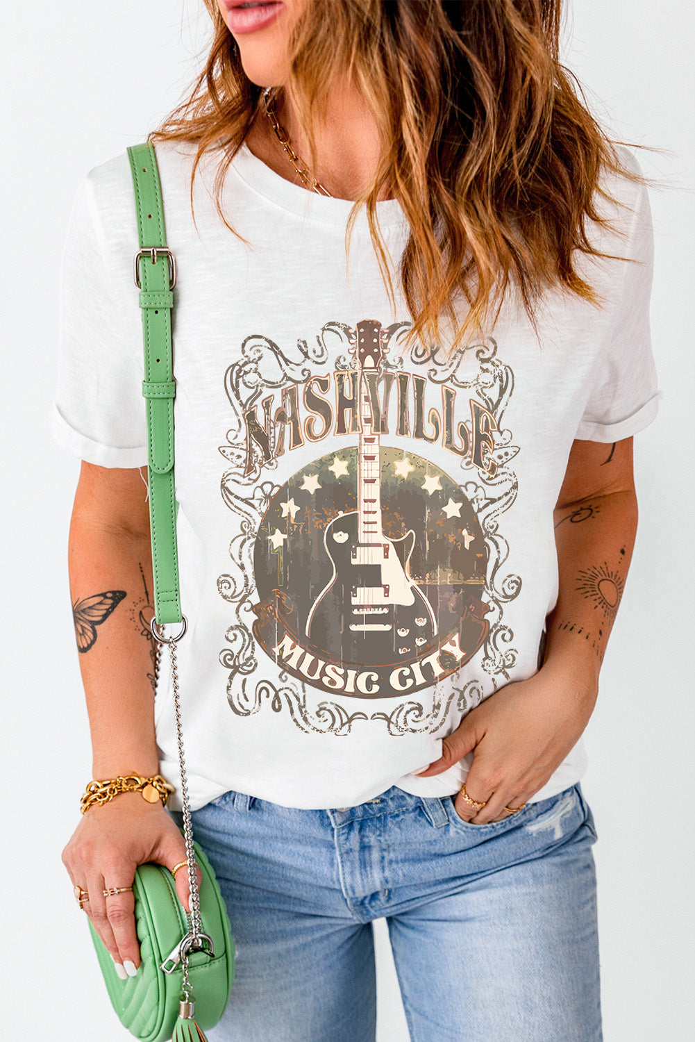 Round neck t-shirt featuring Nashville guitar graphic